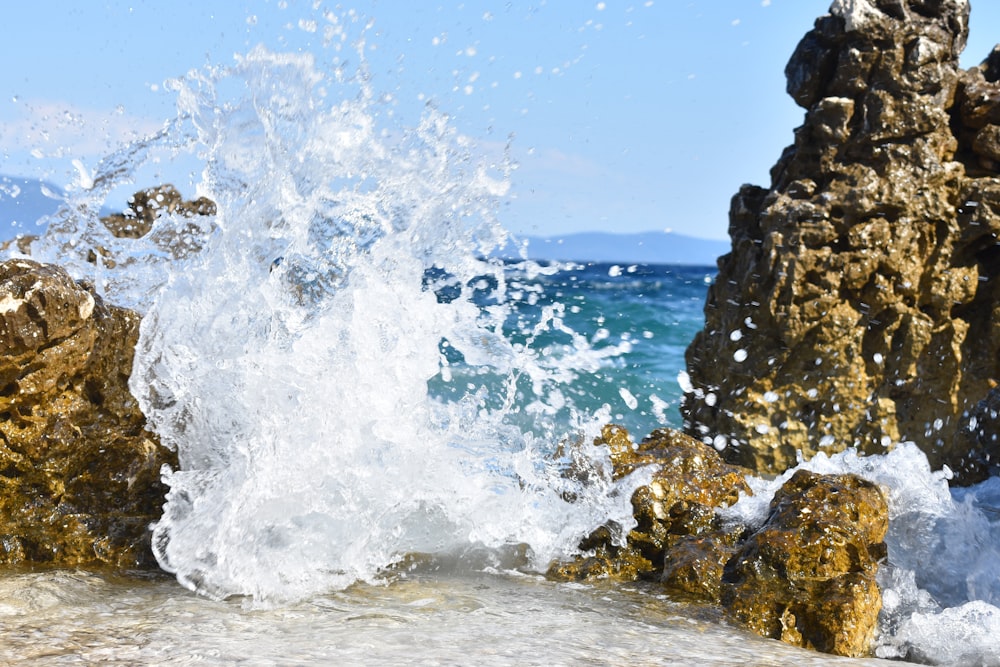 a wave crashing against rocks