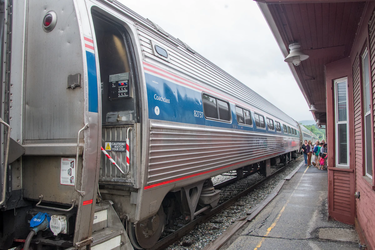 Passenger train pulling into a station platform