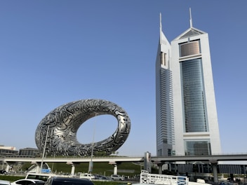 a large building with a ferris wheel in the front