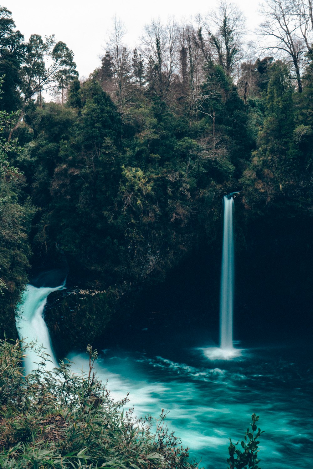 a waterfall in a forest