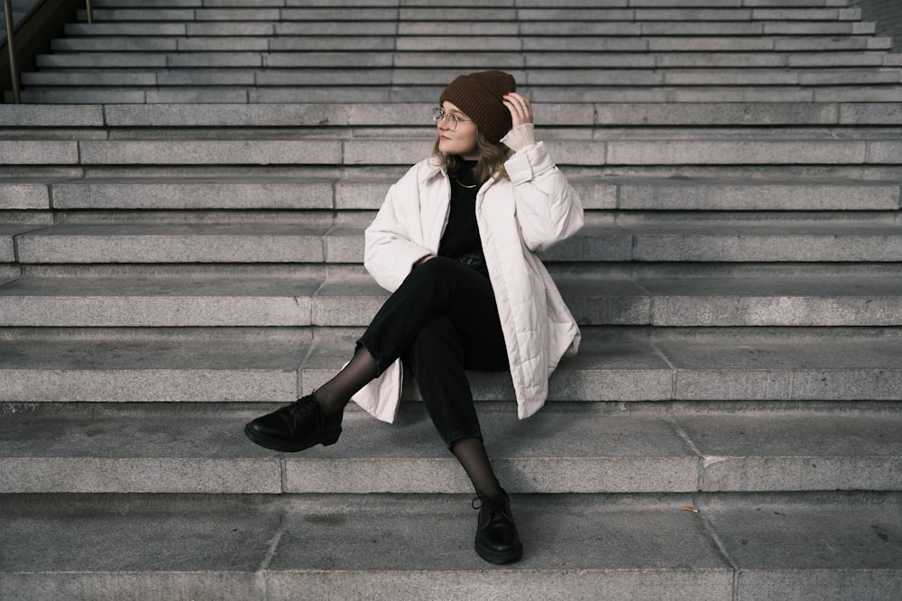 a person sitting on stairs