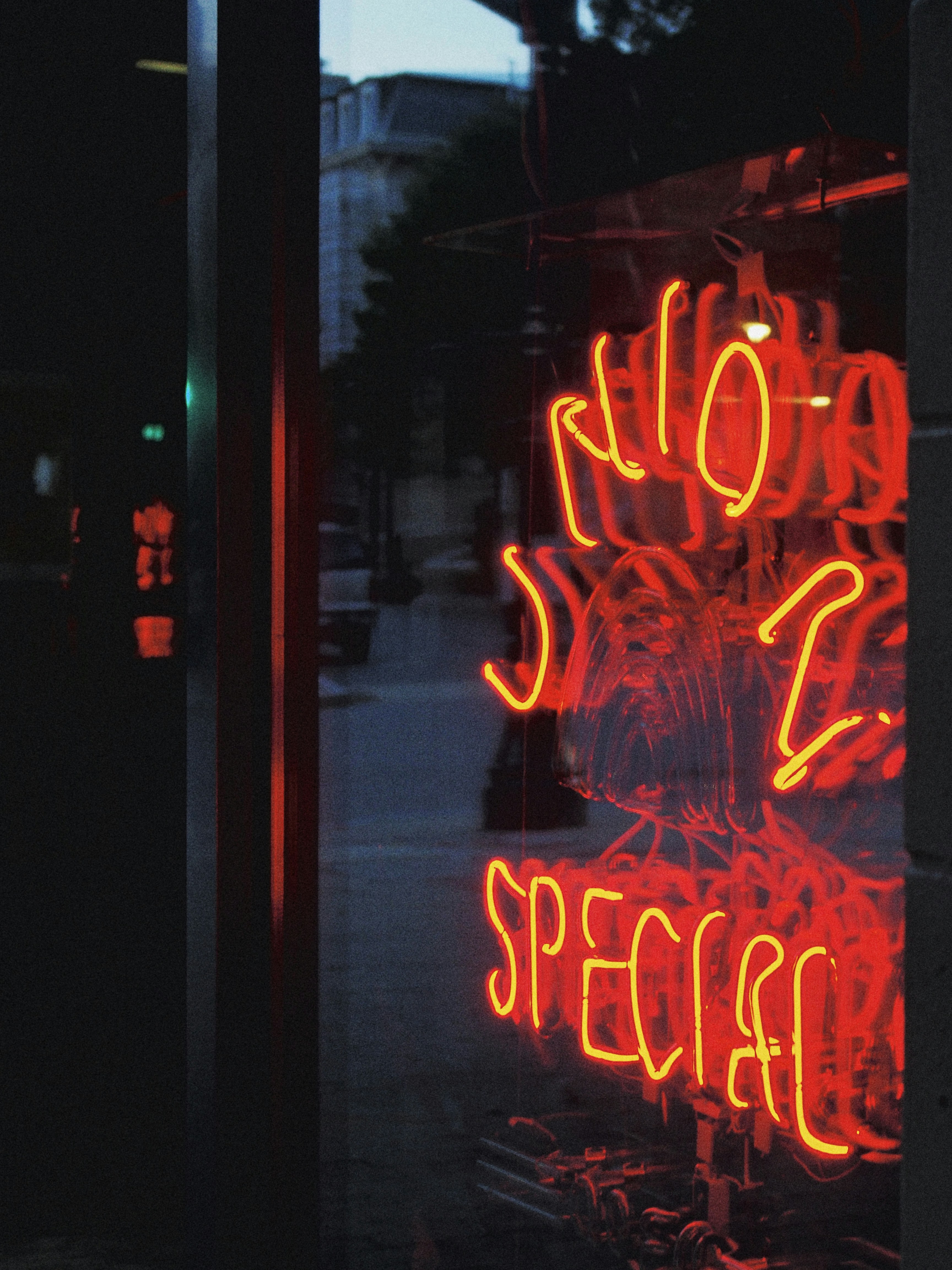 a neon sign on a street