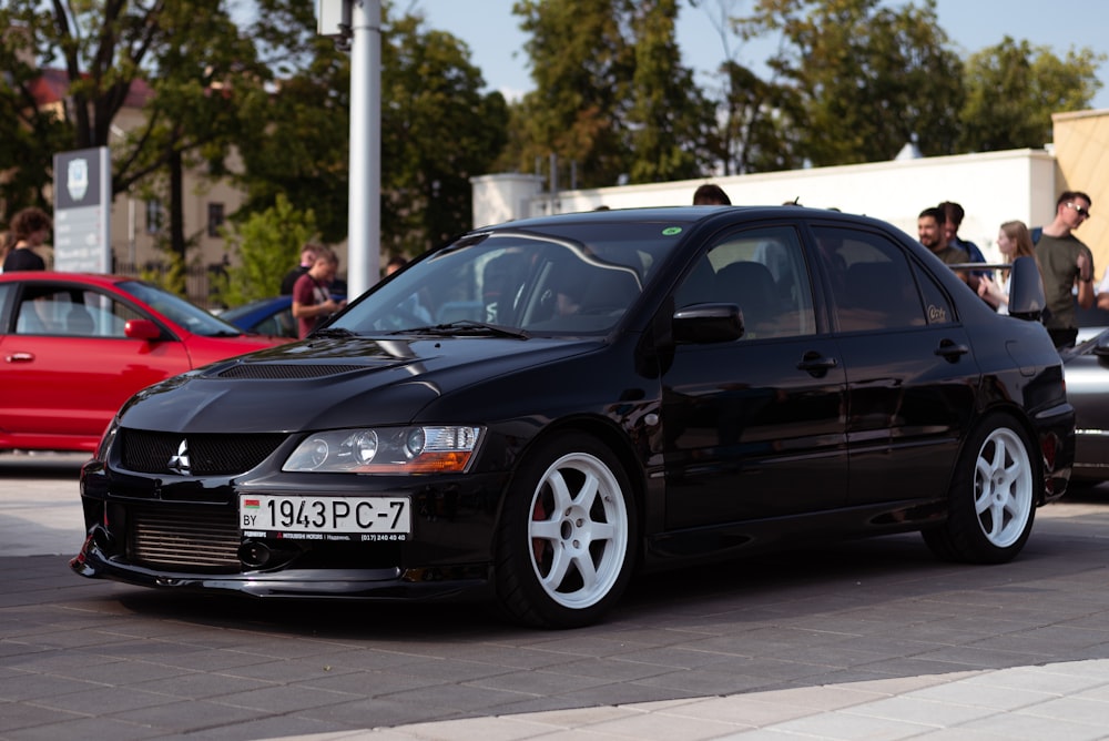 a black car parked on a street