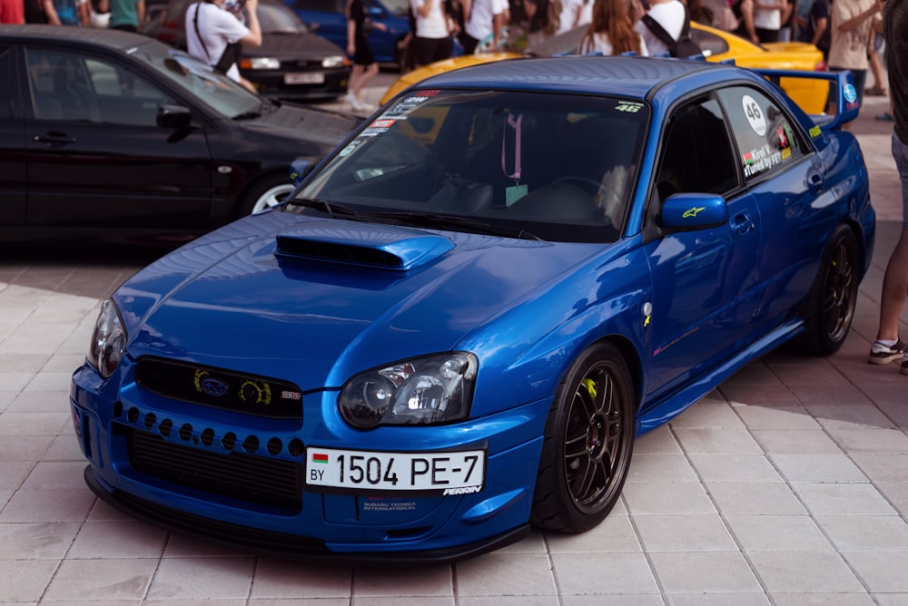 a blue car parked on a tile floor