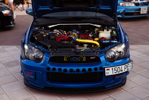 a blue car with a spoiler