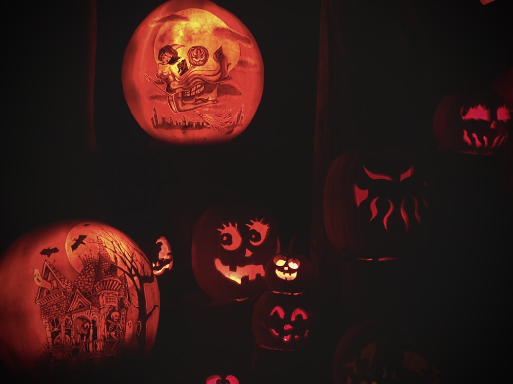 a group of jack-o-lanterns with faces carved into them