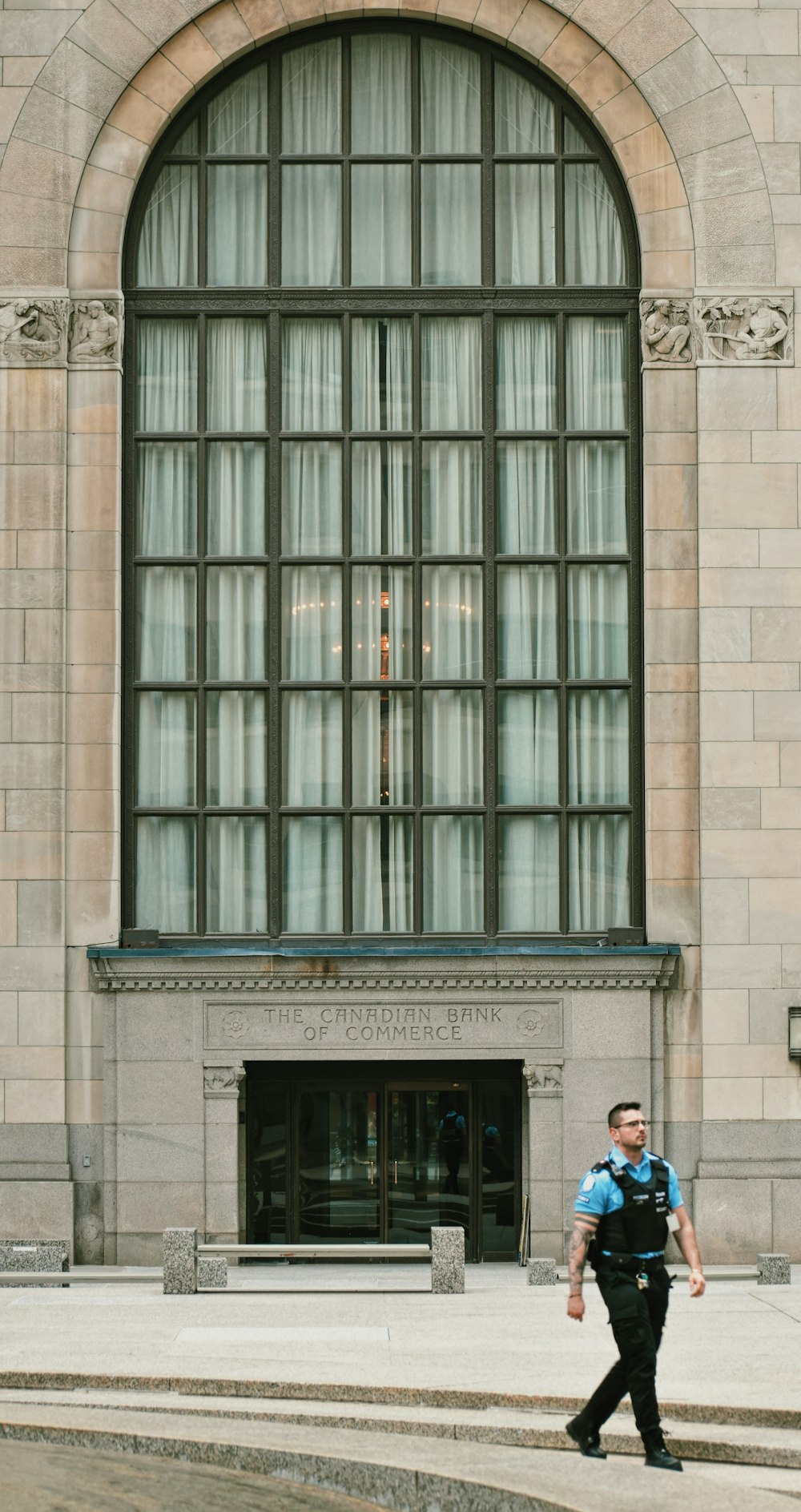 a person walking in front of a building