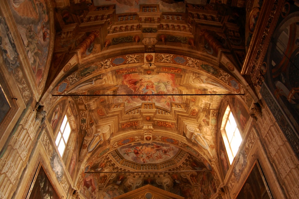 a large ornate ceiling with paintings