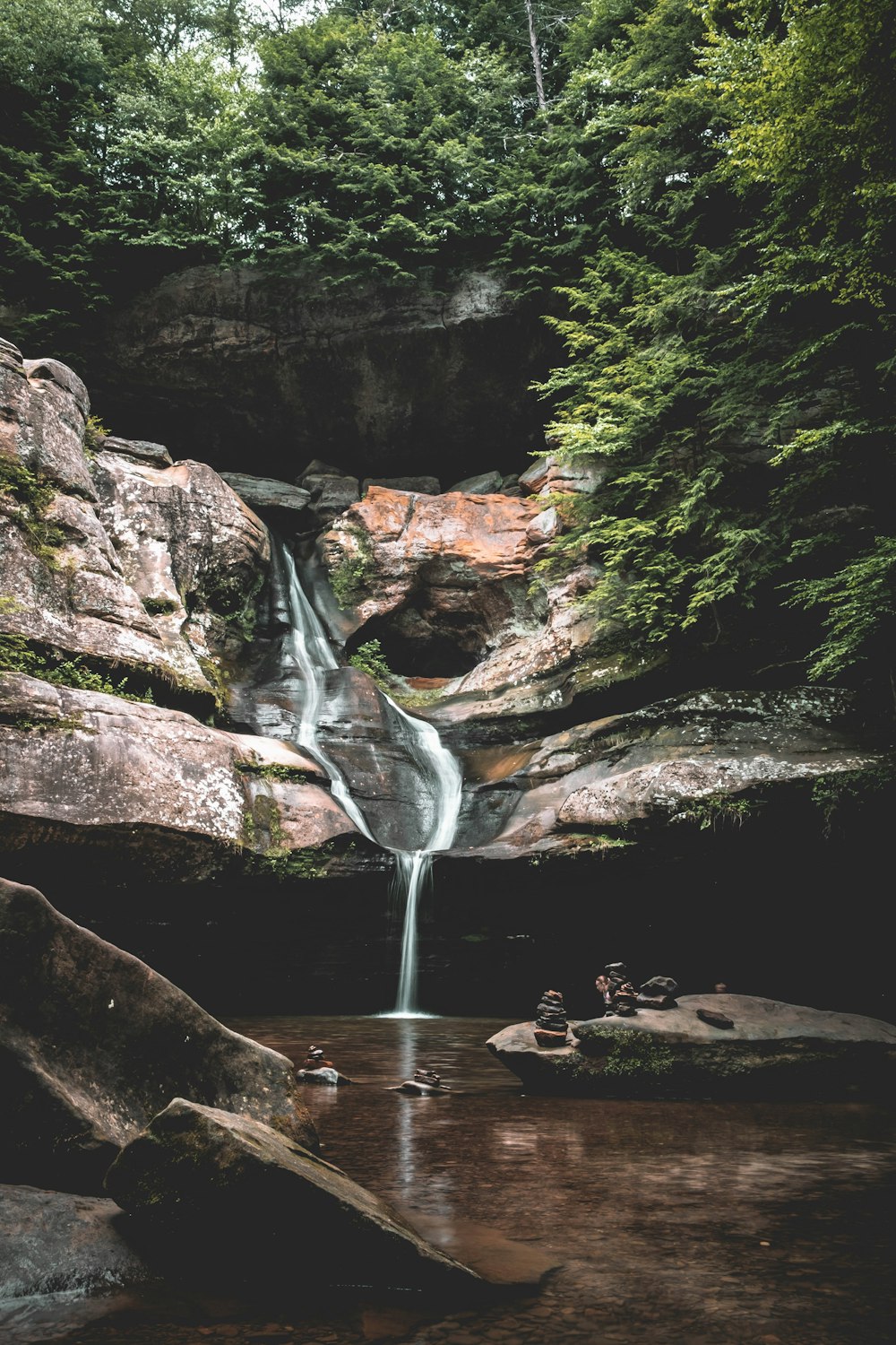 a waterfall over a rock cliff