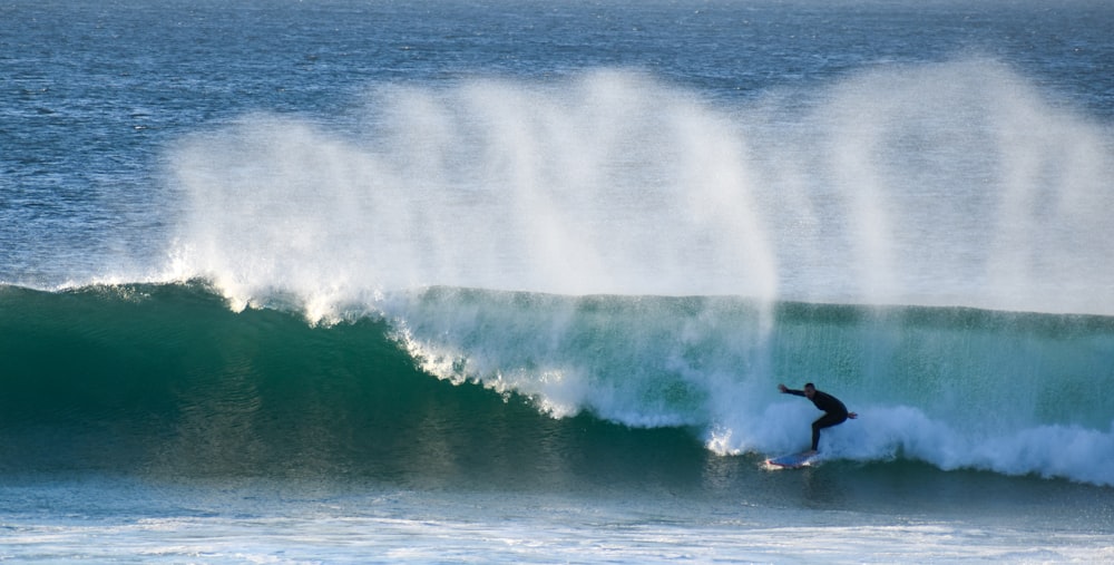 a surfer riding a large wave
