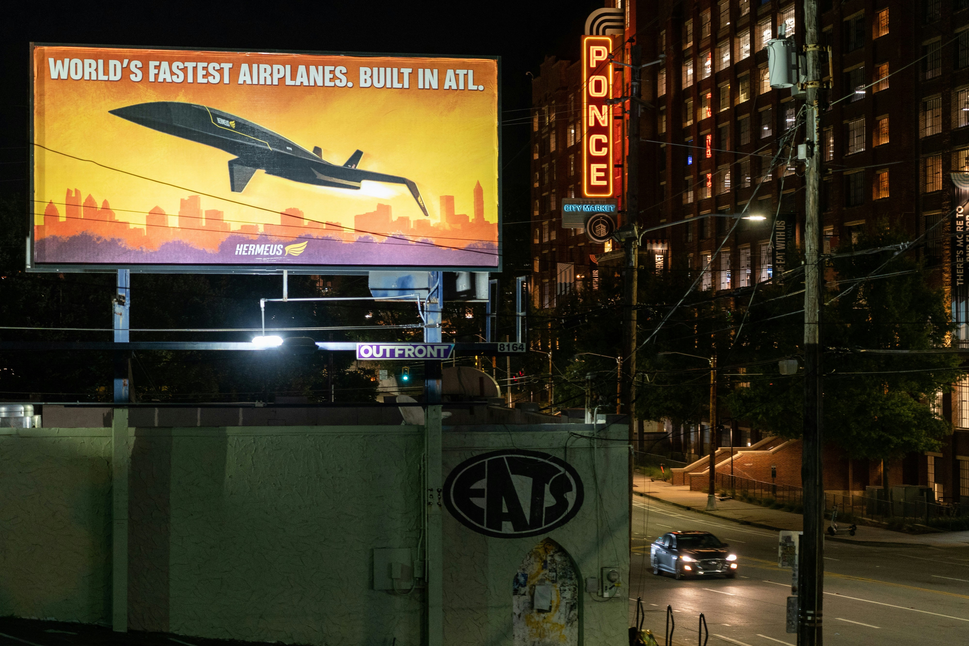a sign on a wall, Hermeus billboard in Atlanta, Georgia.