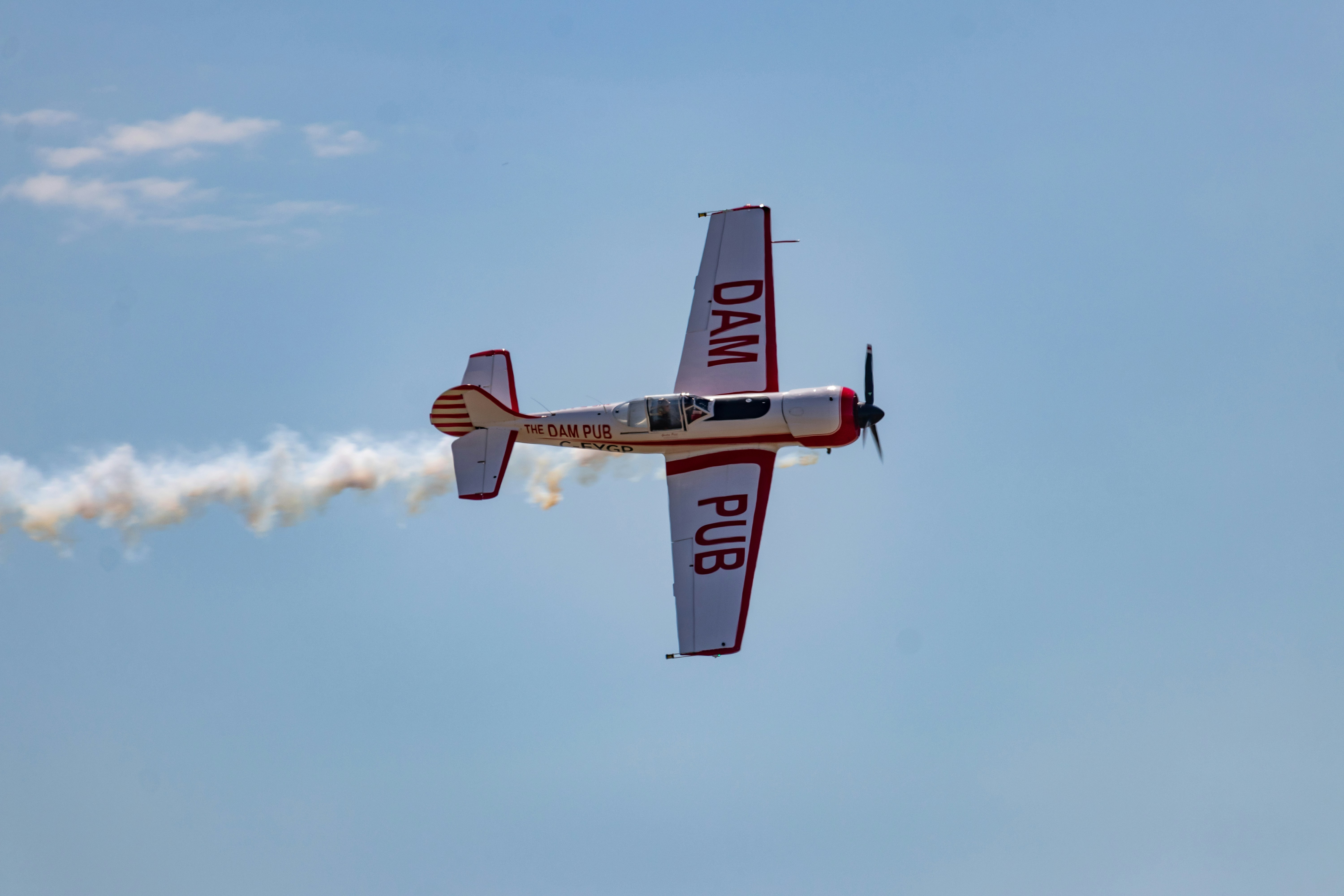 a small airplane flying through the air, 