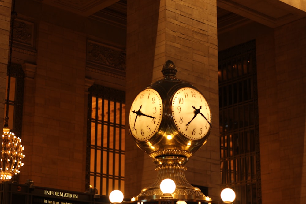 a couple of clocks on a pillar