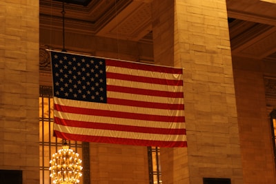 An elegant, classic meeting room with American flags and traditional decor.