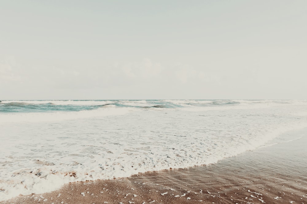 a beach with waves crashing