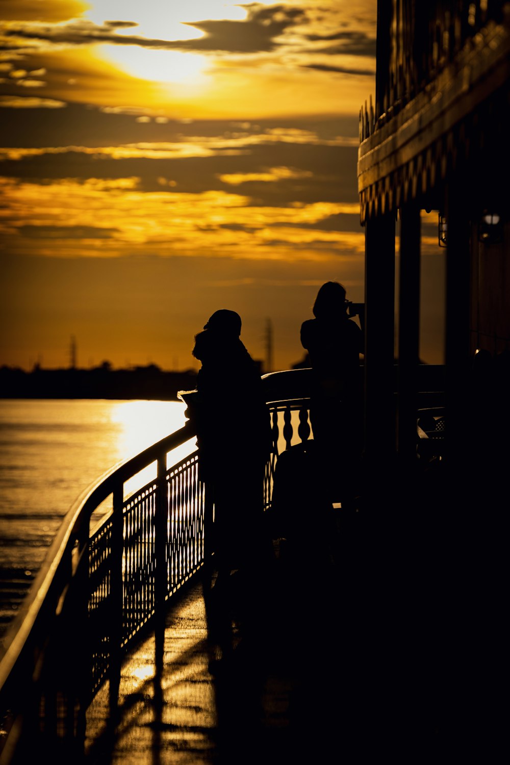 a silhouette of a couple of people