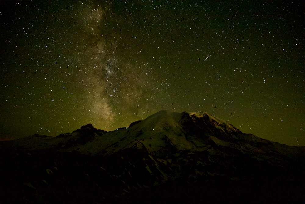 a mountain with stars in the sky