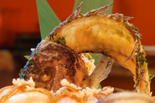 Close-up of a beautifully plated seafood dish featuring fresh Aegean ingredients.