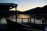 Lake-view deck overlooking serene Lake Batur with Mount Batur in the background at sunset.