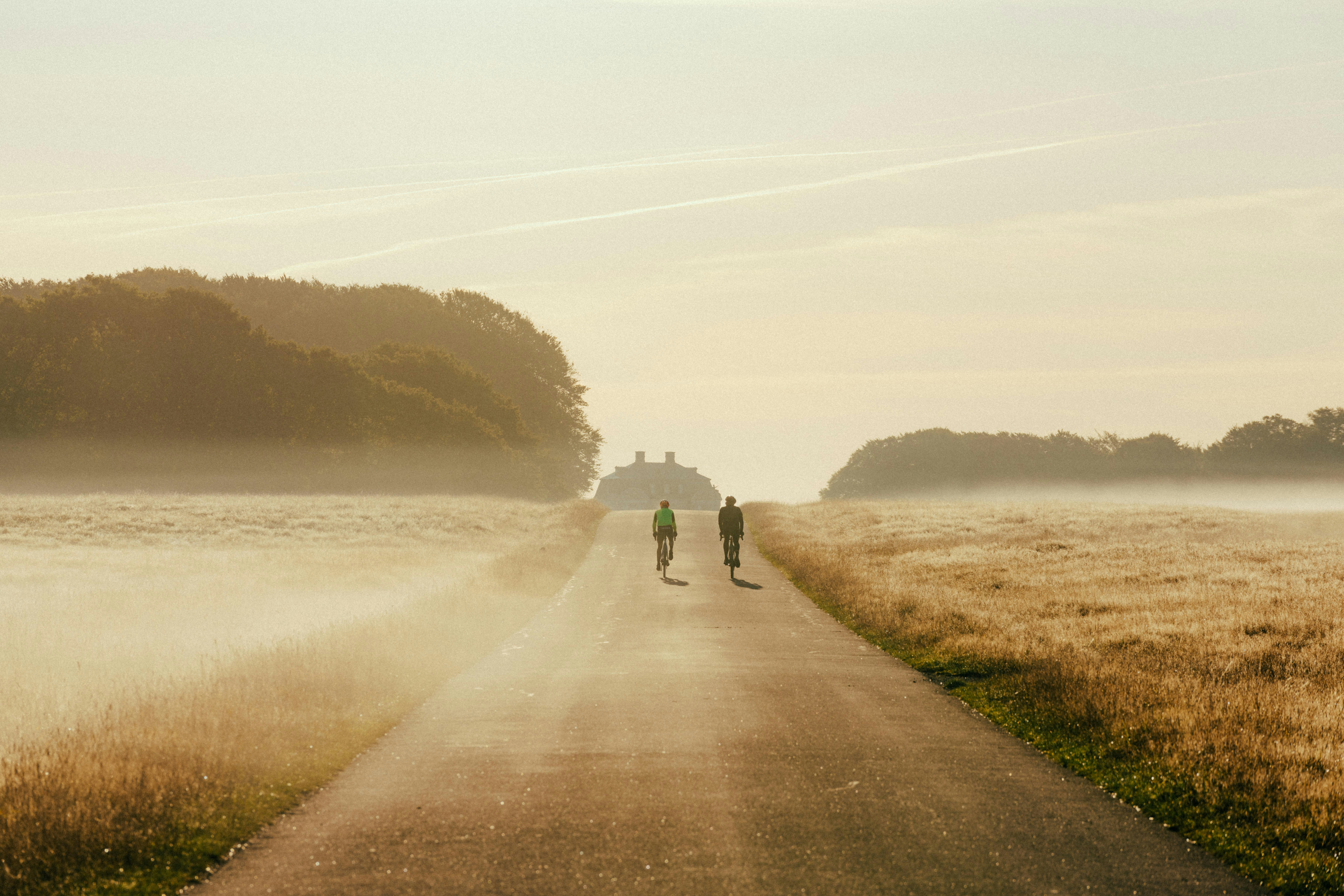 Couple walking on scenic path by water