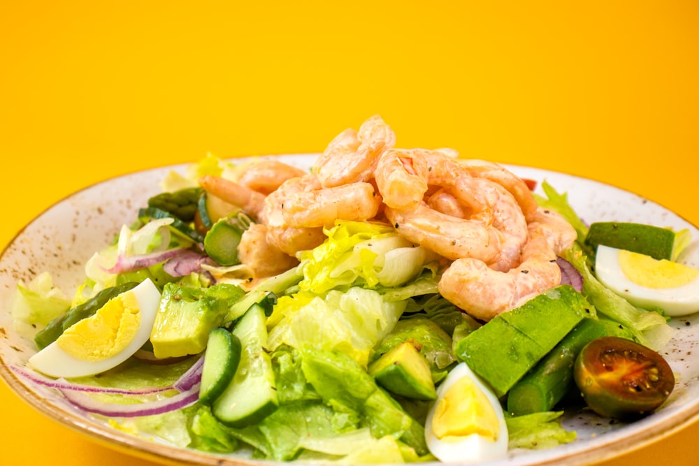 a plate of seafood and vegetables