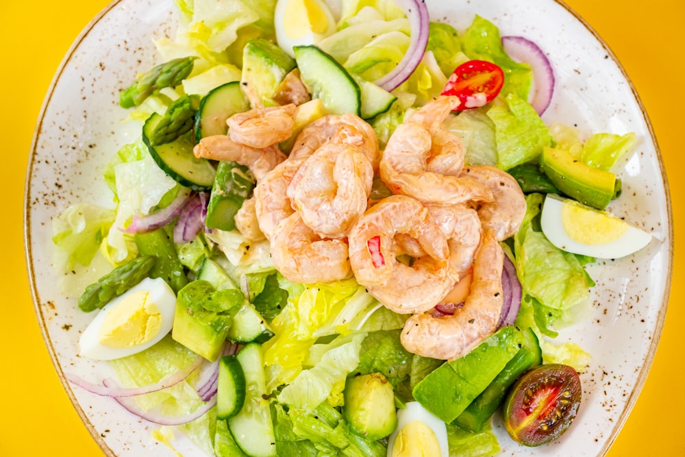 a plate of seafood and vegetables