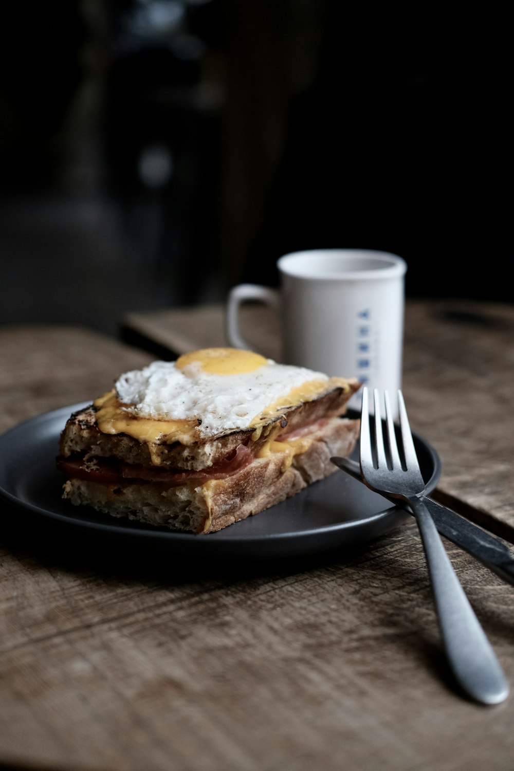 a plate of food and a cup of coffee