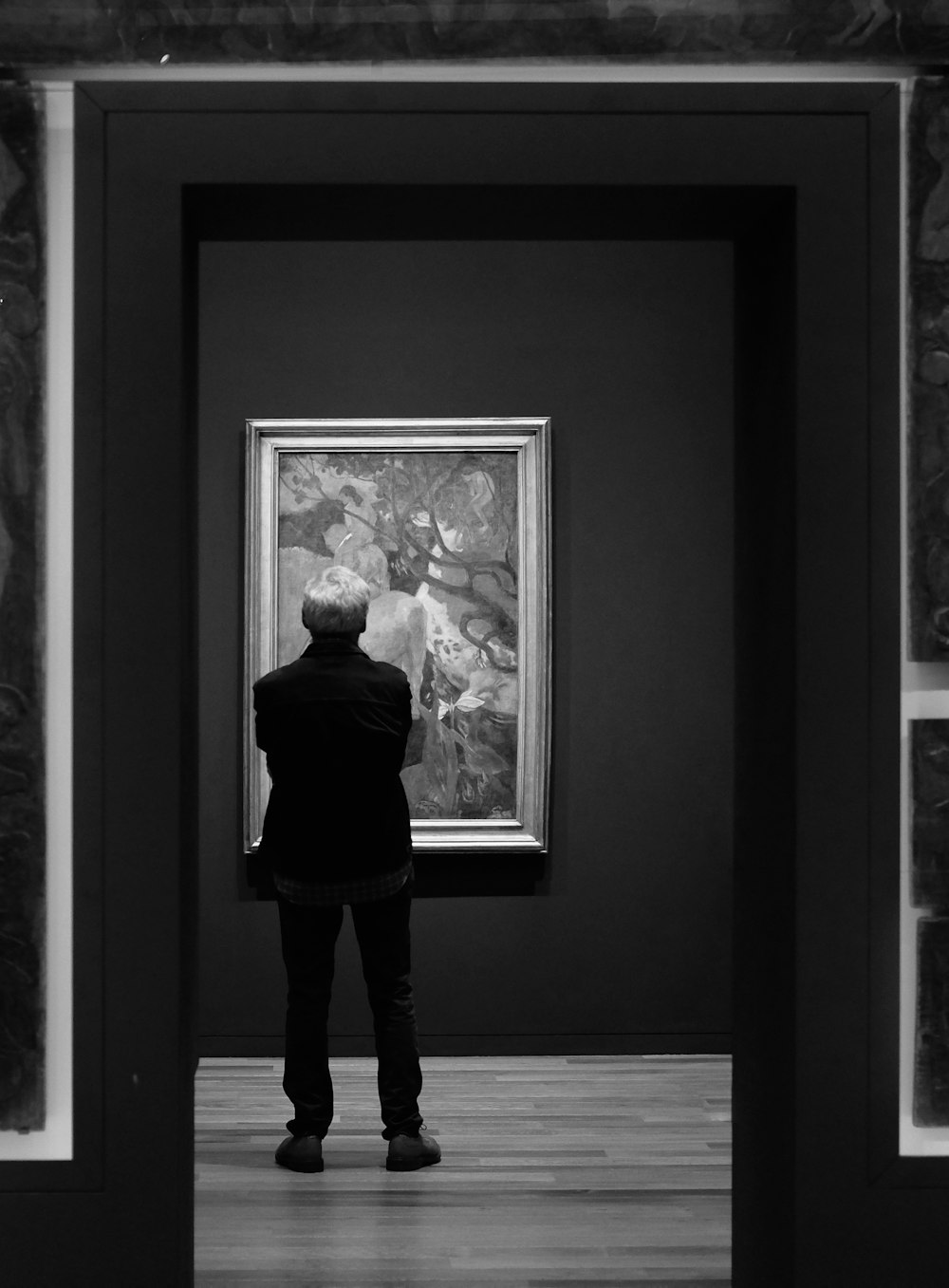 a person looking at a painting