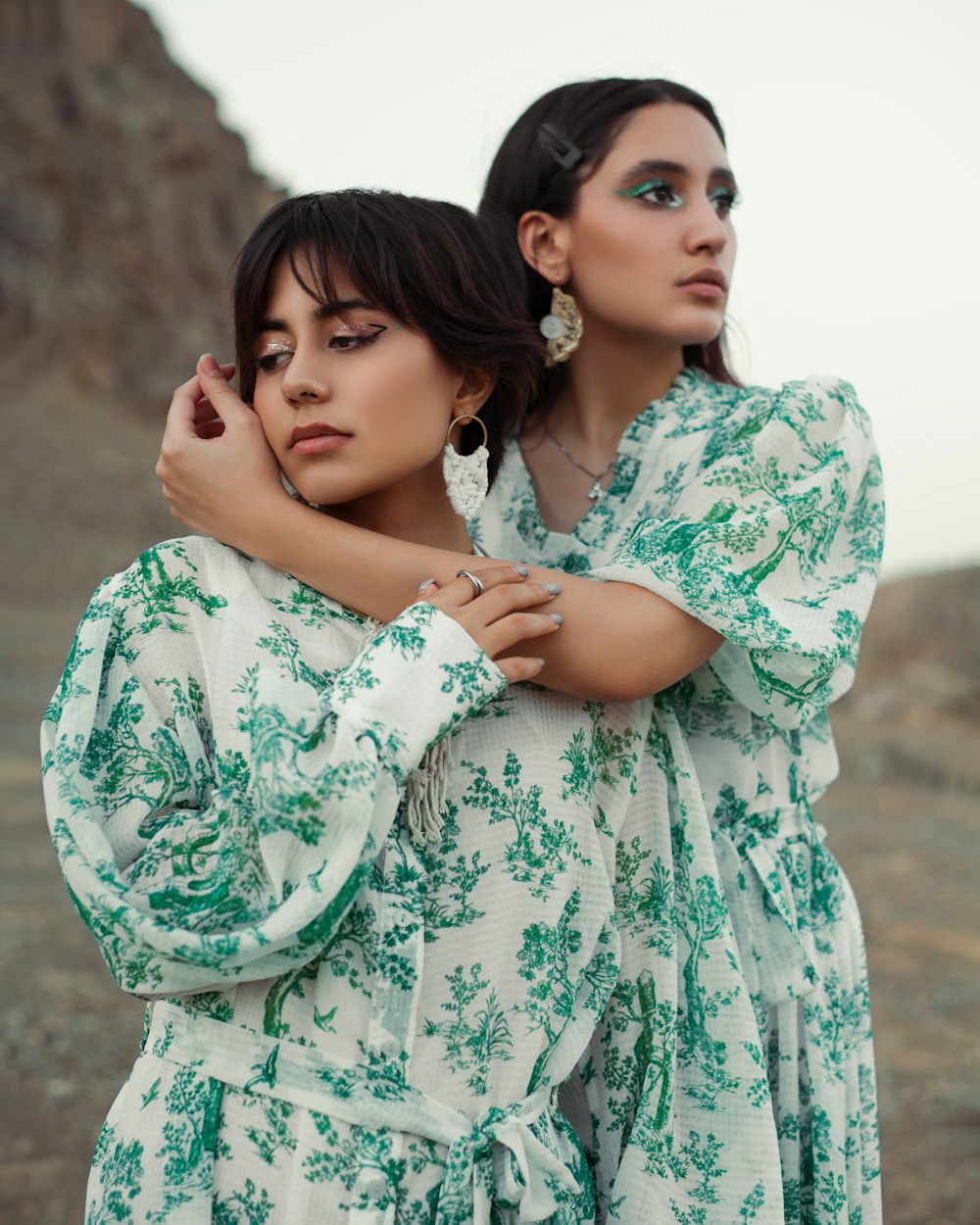 a couple of women posing for the camera