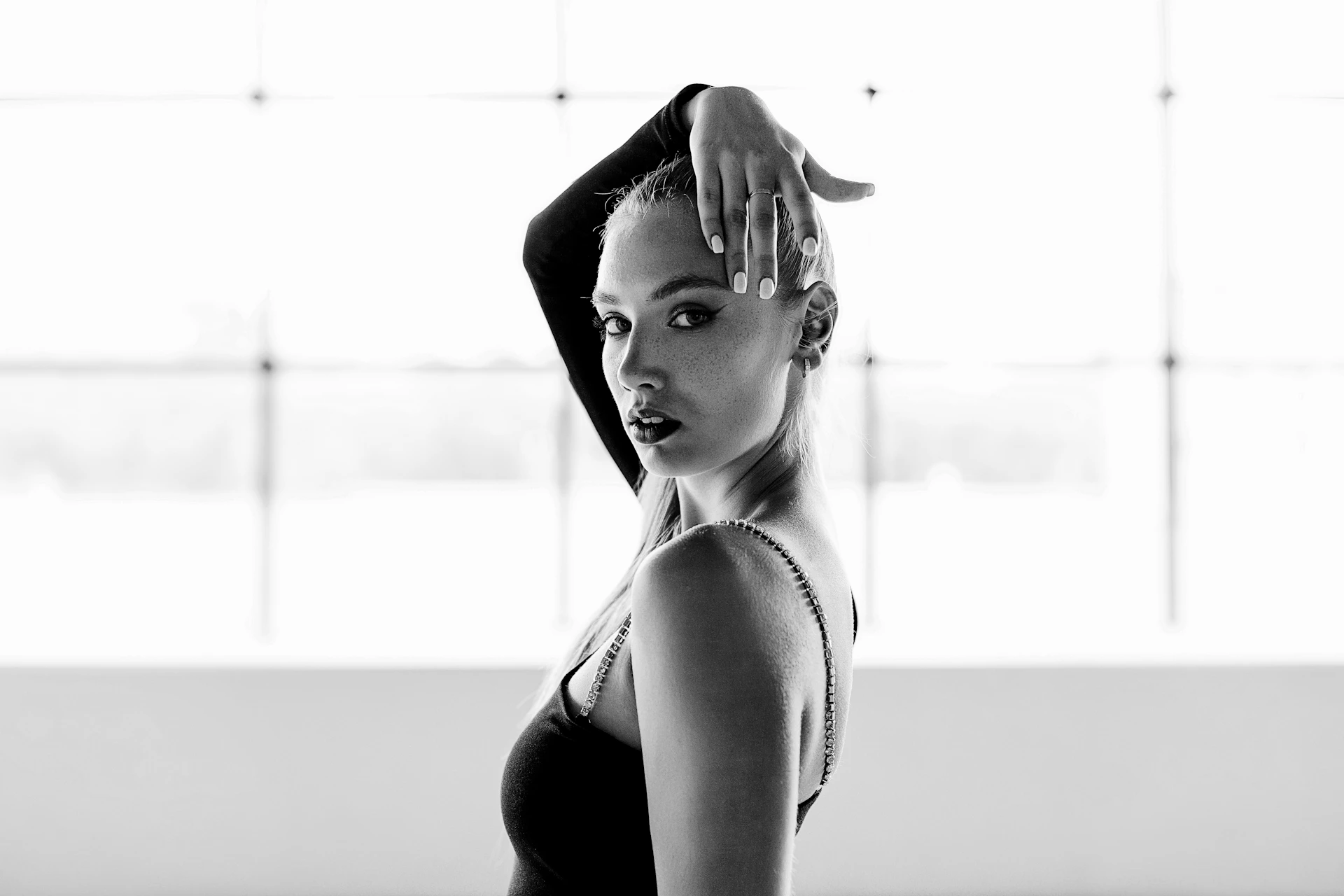 a woman with her hand on her head