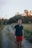 a man standing on a dirt road