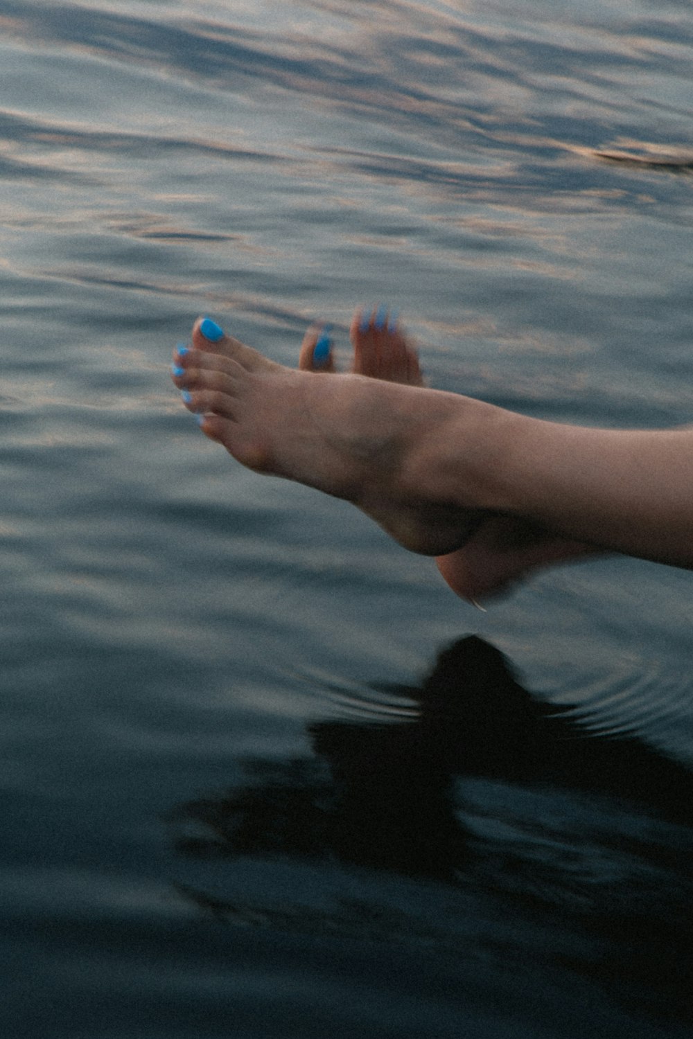 a person's feet in the water