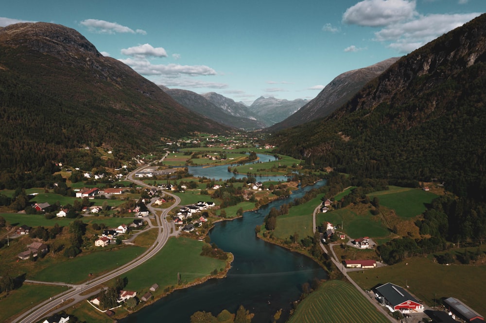 a river running through a valley between mountains