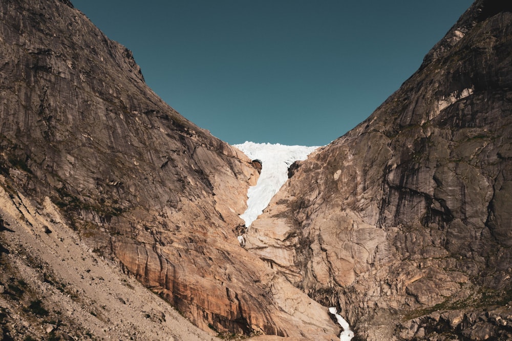 a canyon with a mountain in the background