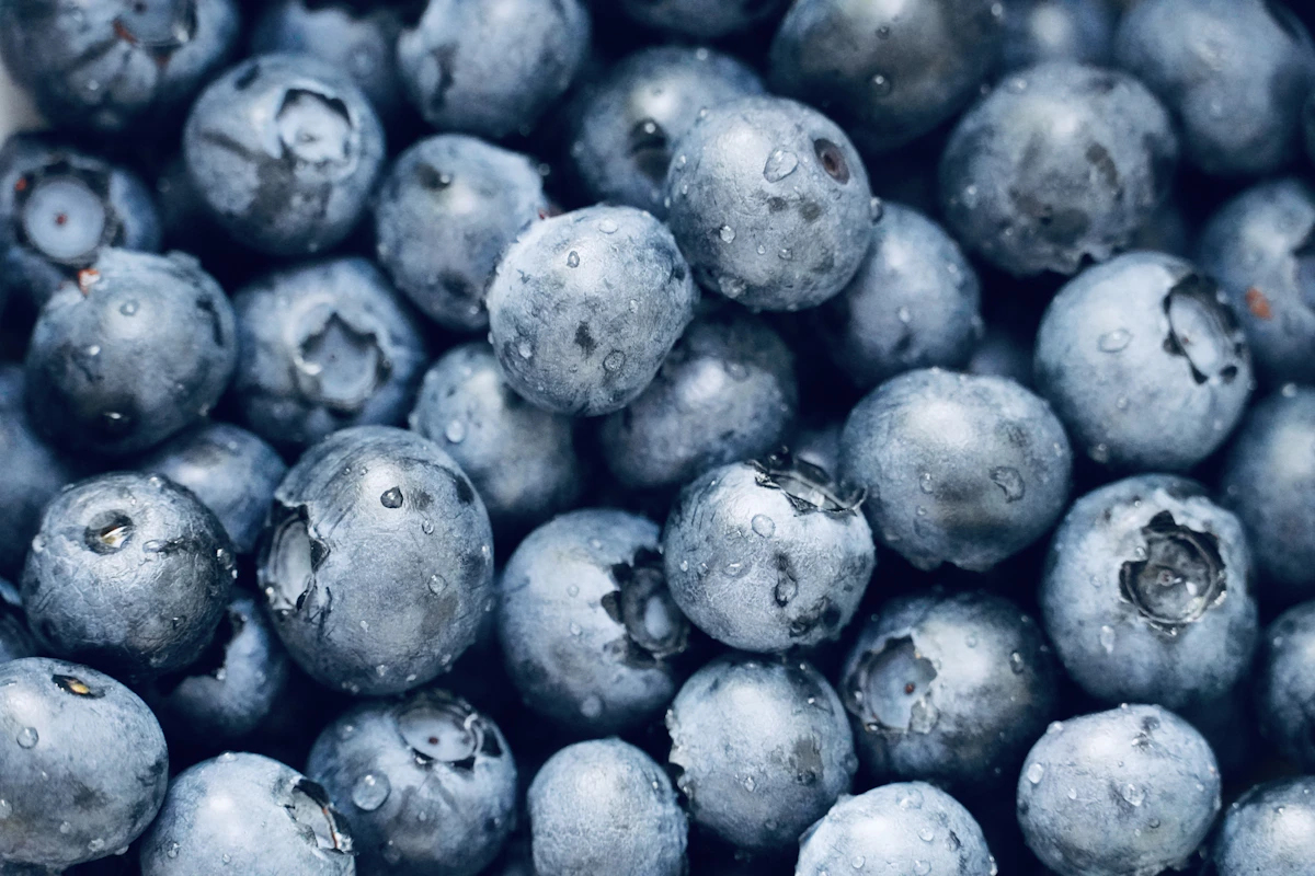 Close-up of fresh blueberries, illustrating the fruit-flavor collection