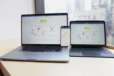 a couple of laptops on a table