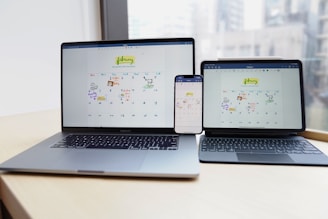 a couple of laptops on a table