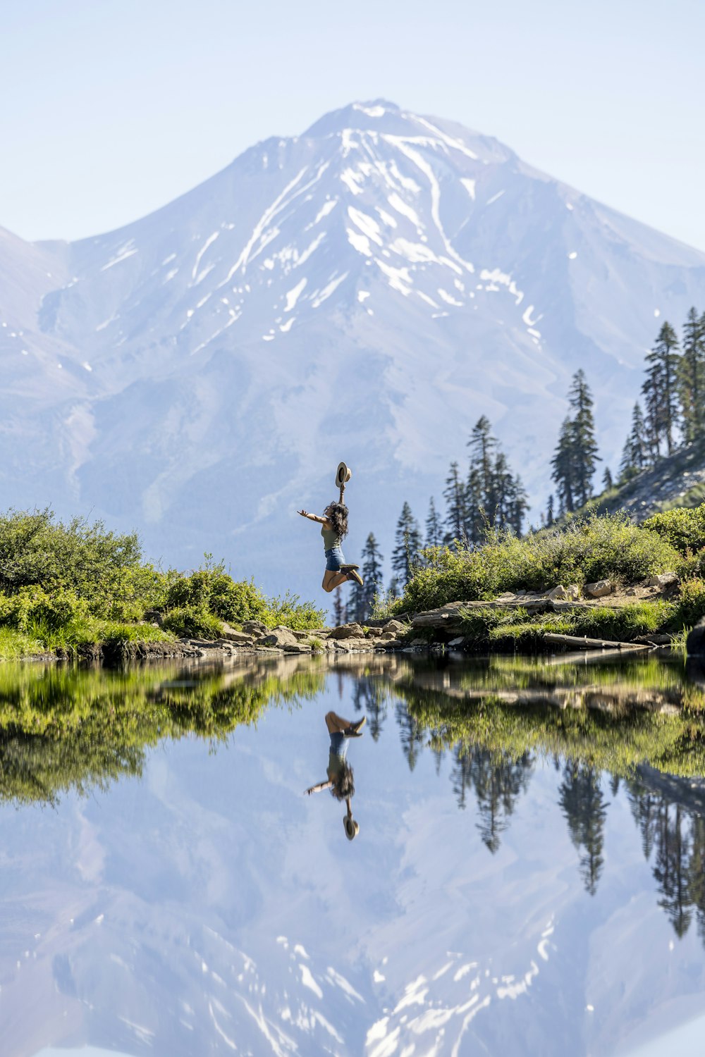 a person jumping into a lake