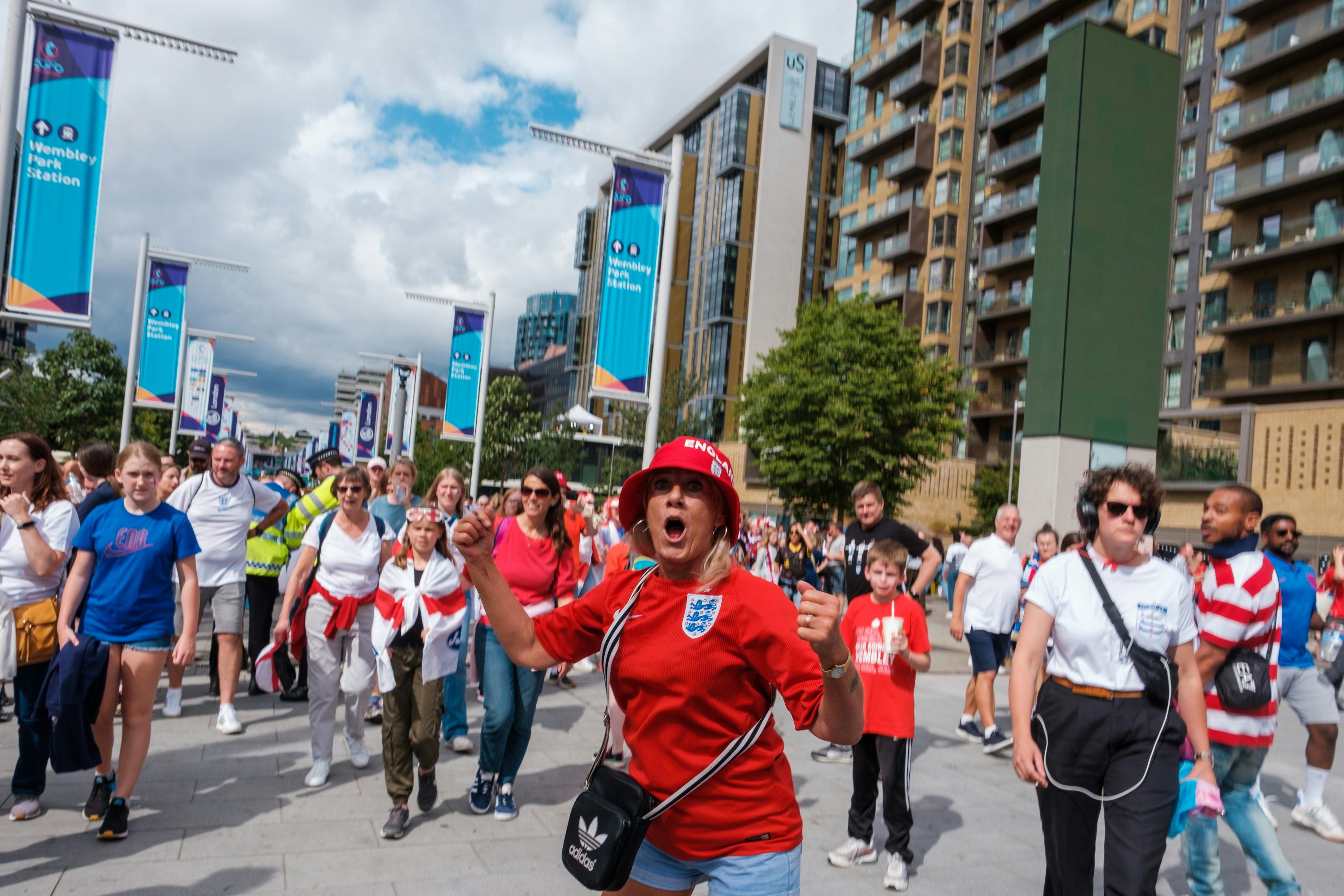 a group of people walking on a street