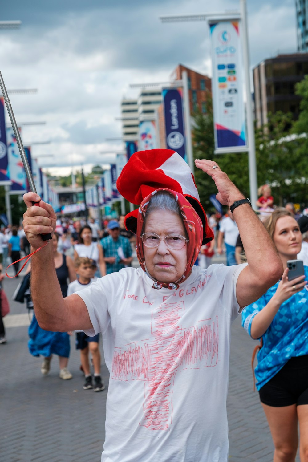 a person wearing a red hat and holding a sword