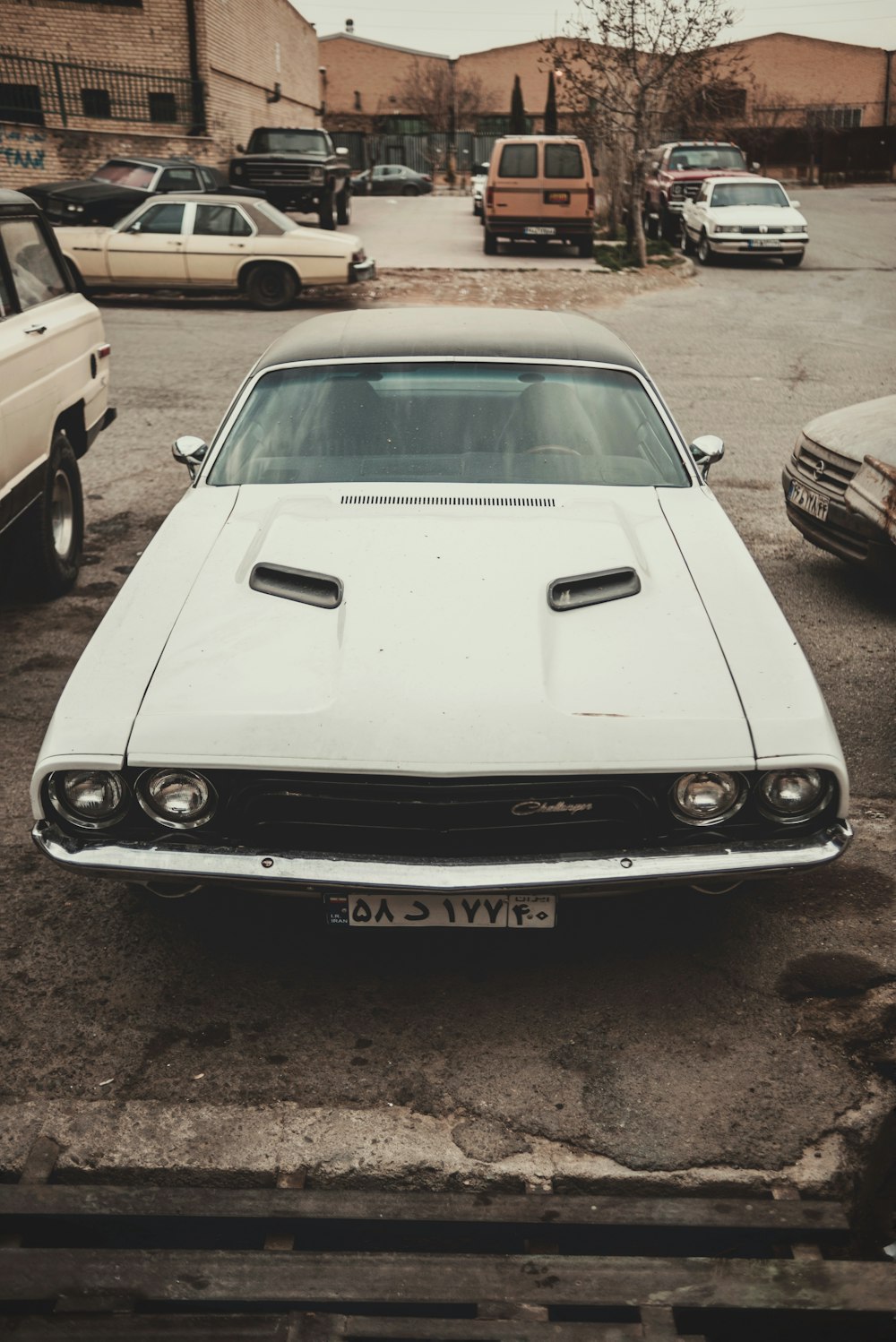 a white car parked in a parking lot