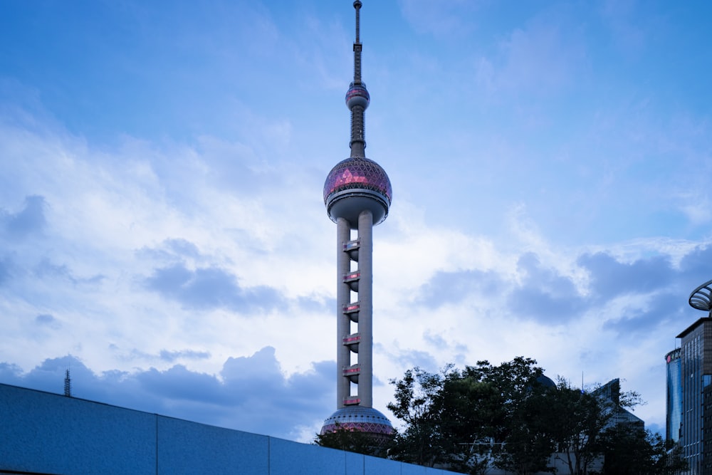 a tall tower with a purple top