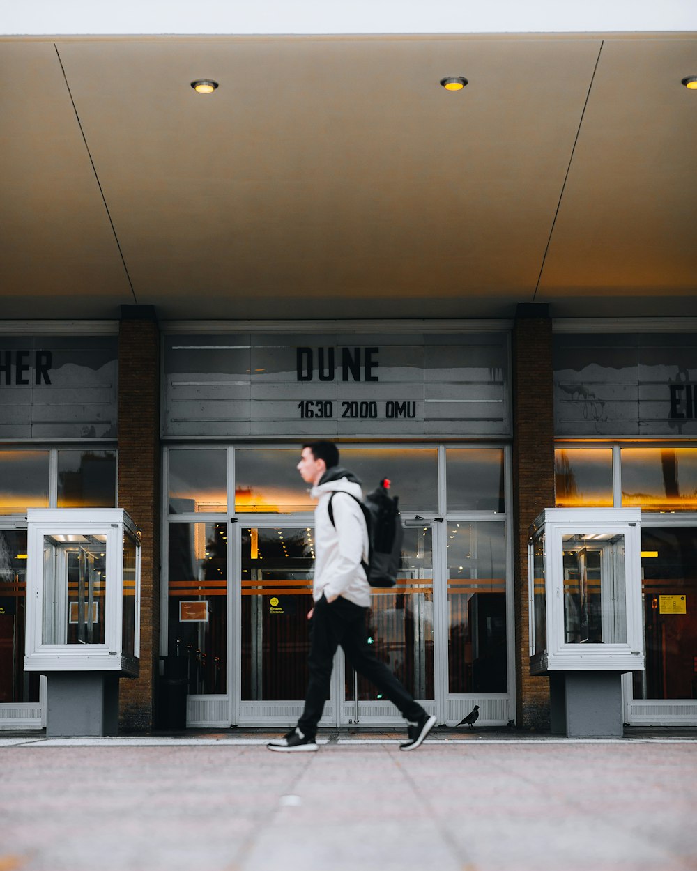 a man walking out of a building