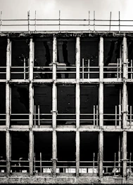 a black and white photo of a prison cell