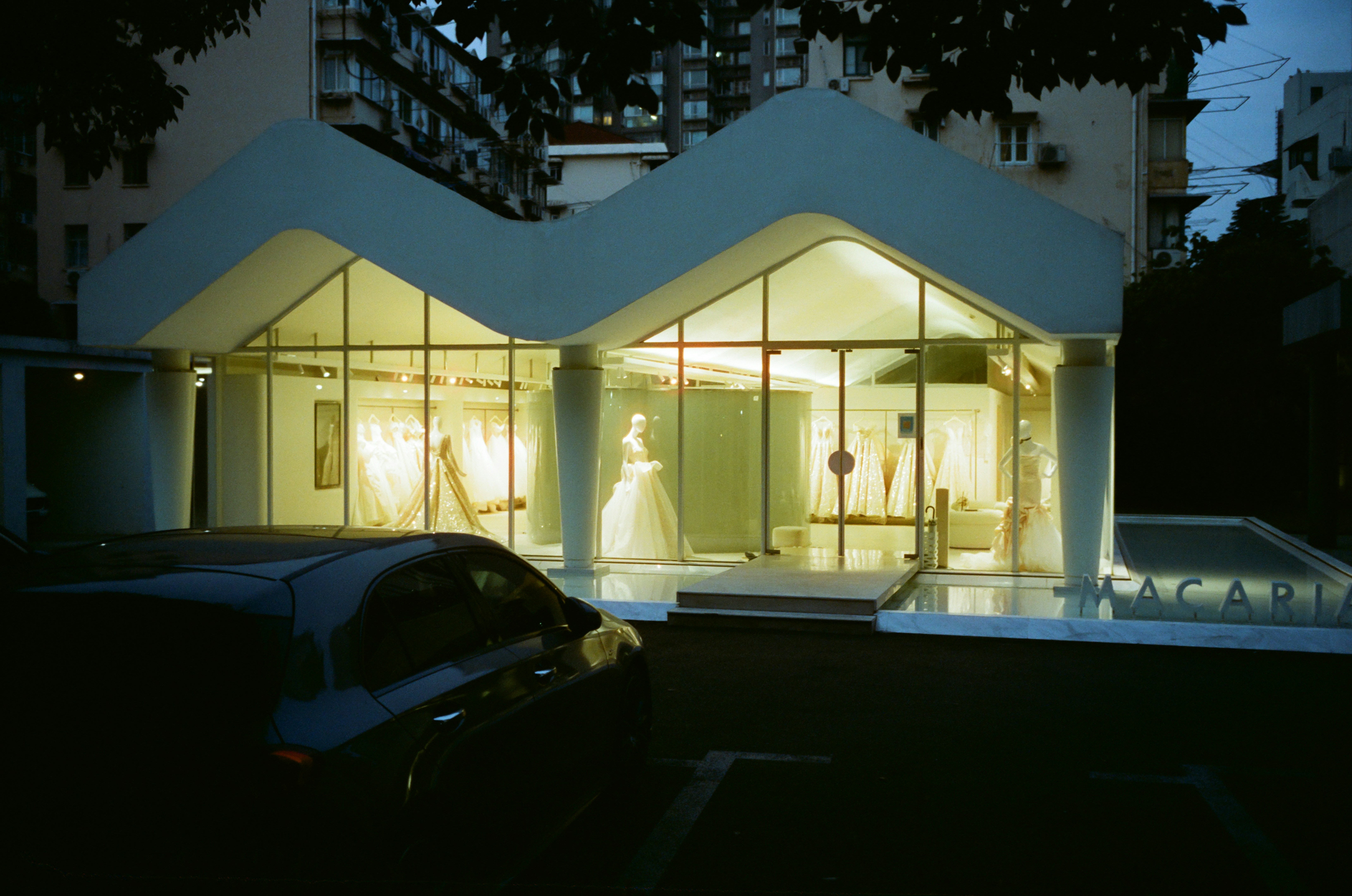 A house with a car parked in front of it