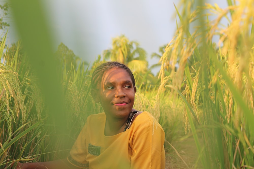 a person standing in a field of wheat