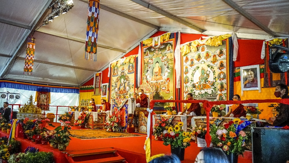 a group of people in a room with colorful decorations