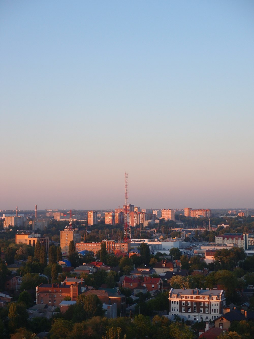 a city with a tall tower in the distance