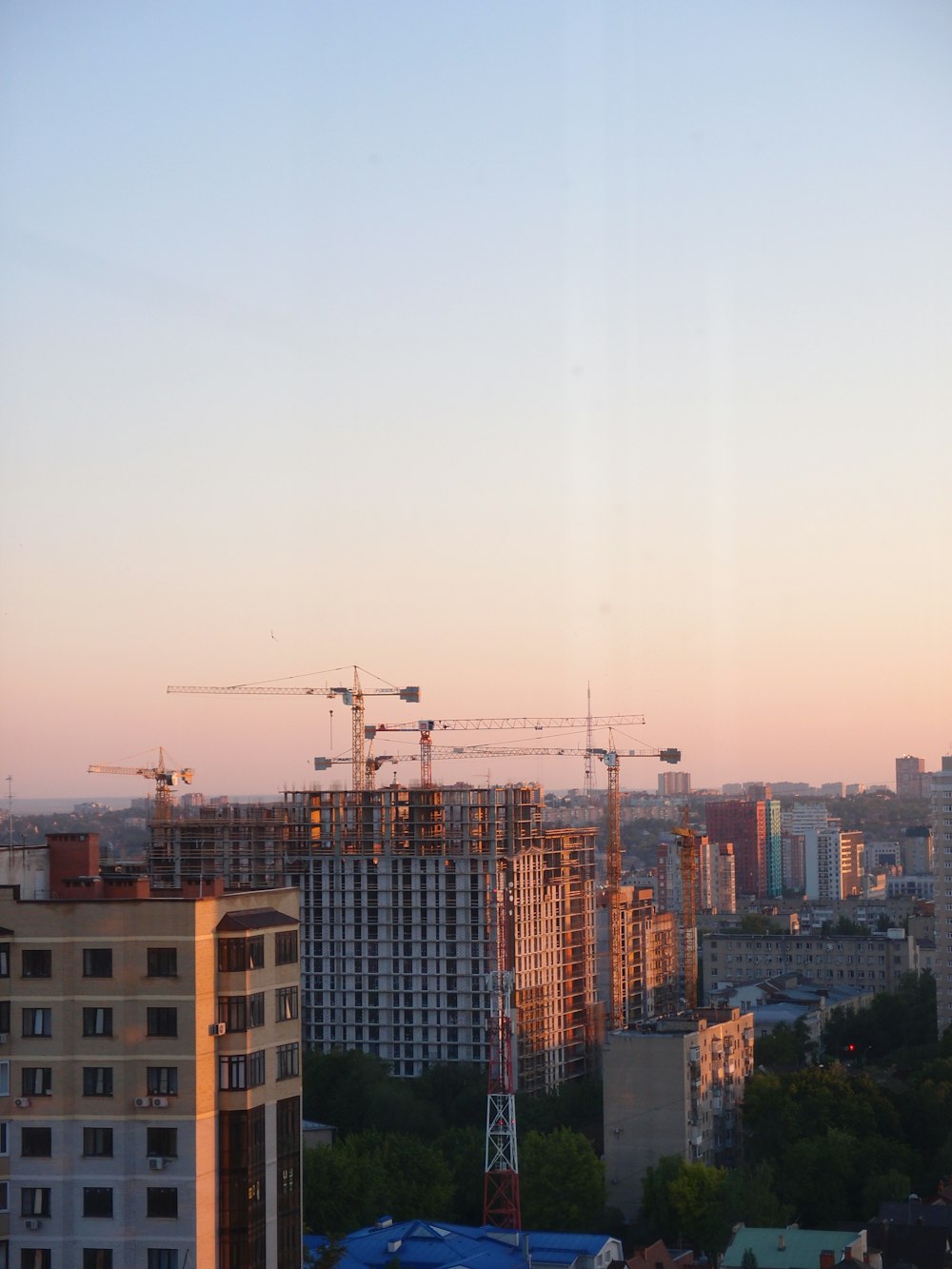 a group of cranes in a city