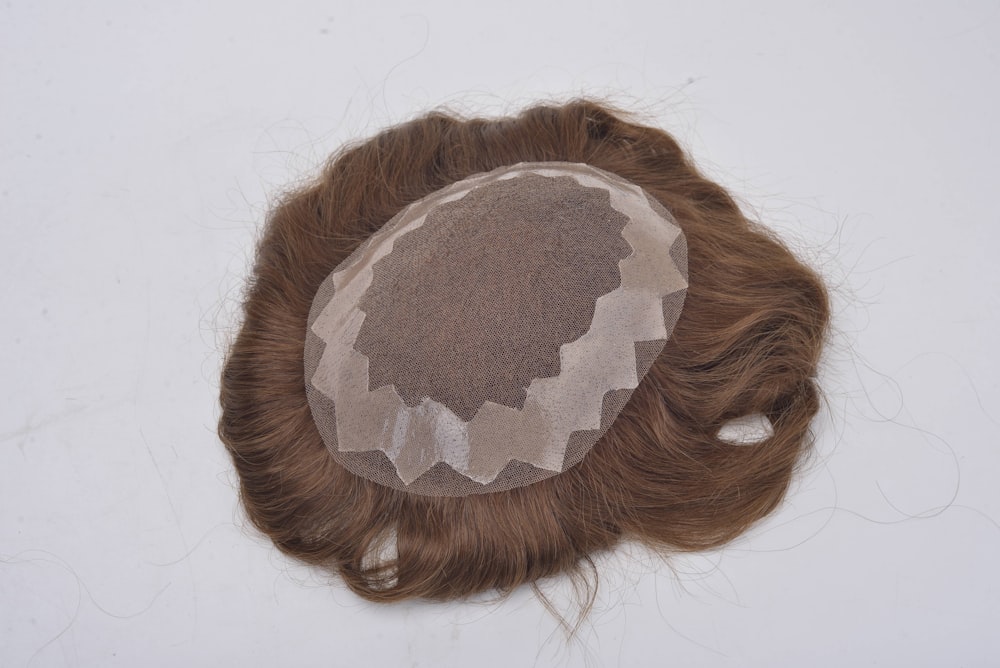 a brown and white braided braided hair